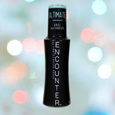 A black bottle of Encounter "Ultimate" Anal Lubricant | 2oz, ideal for those seeking paraben-free options, is displayed against a background with colorful, blurred lights. The bottle features a sleek design with blue and white text.